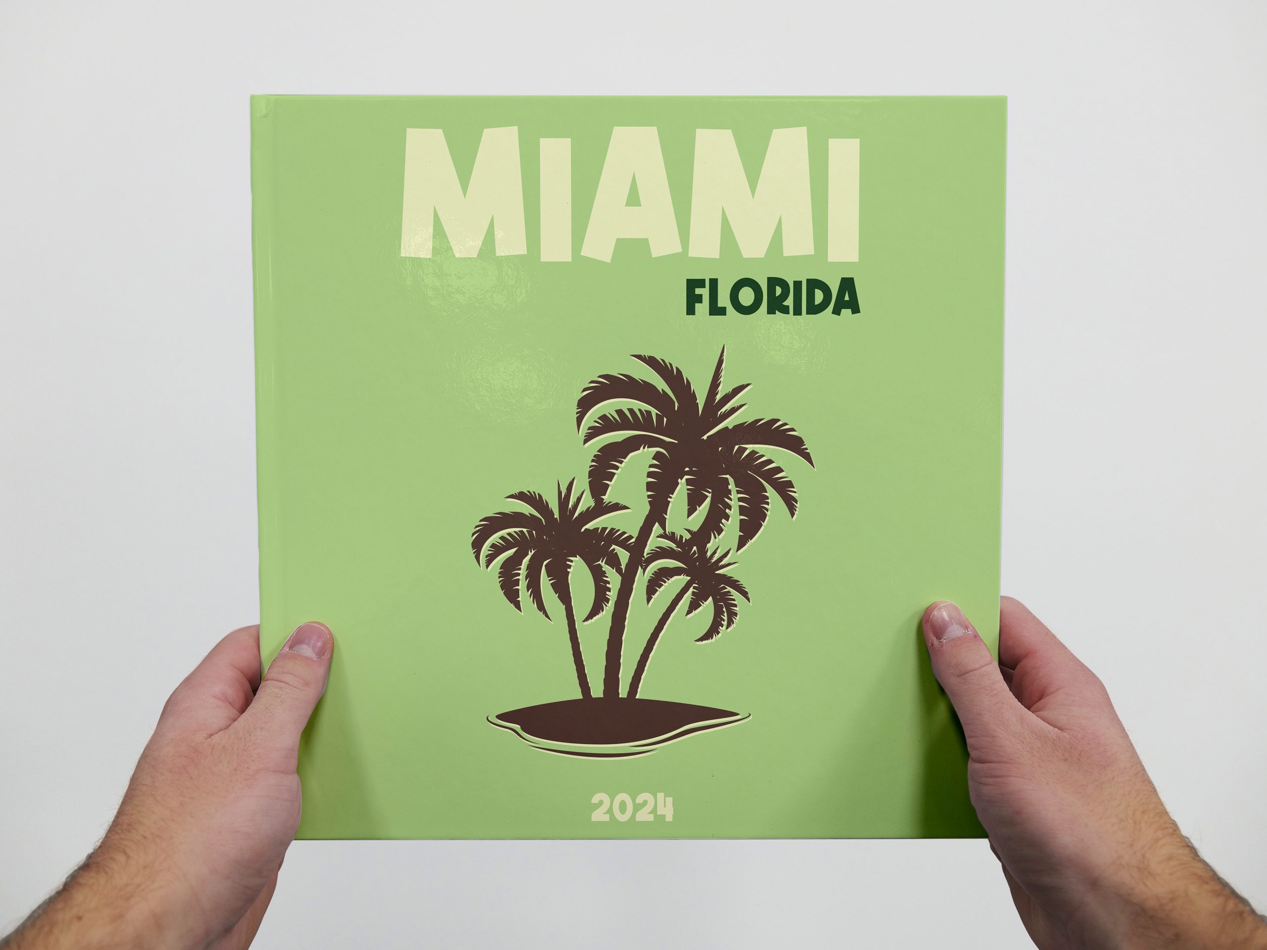 Kvadratisk fotobog med palmer